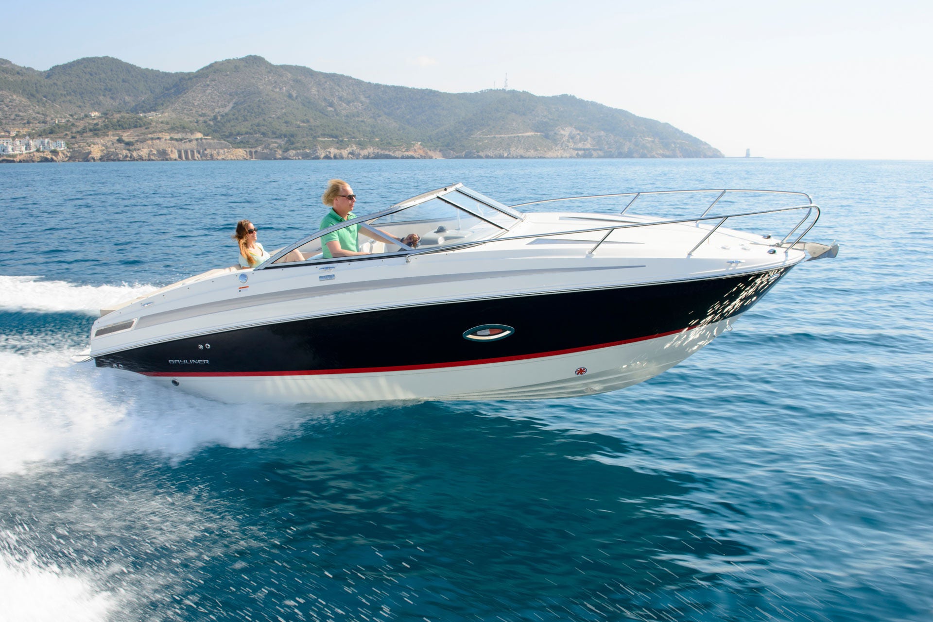 man and woman riding on the 742R overnight boat
