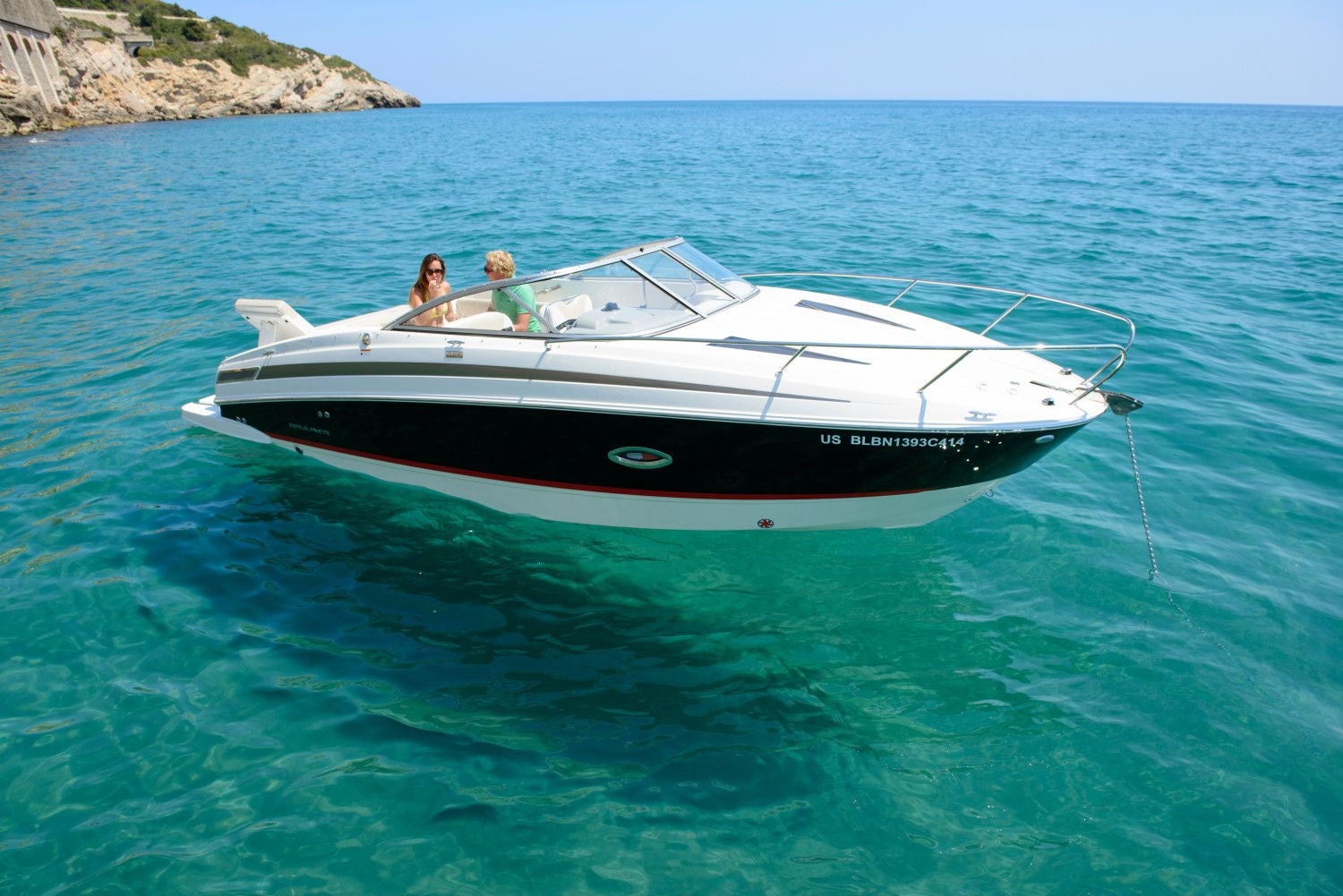 man and woman lounging on the 742R overnight boat