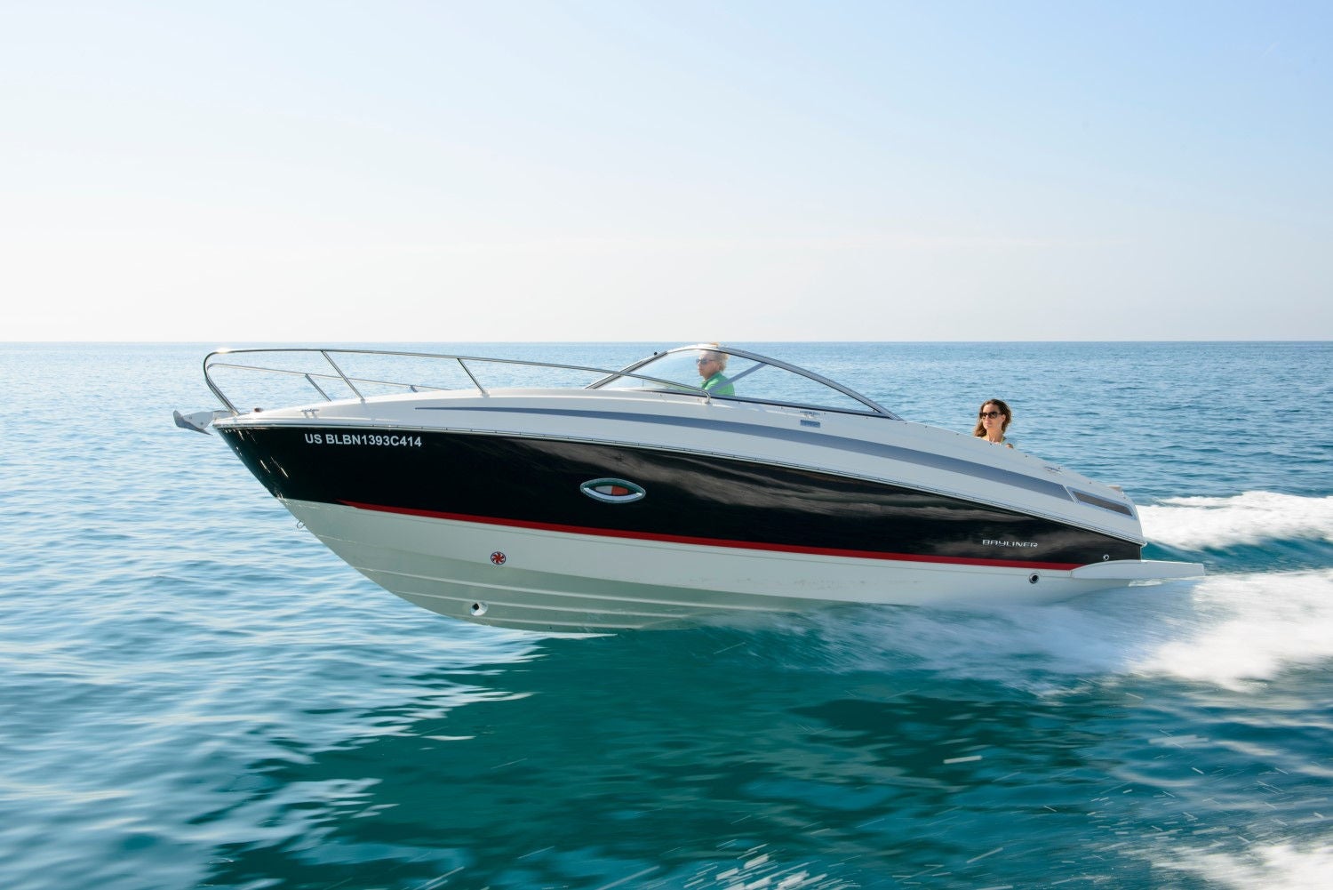 man and woman riding on the 742R overnight boat