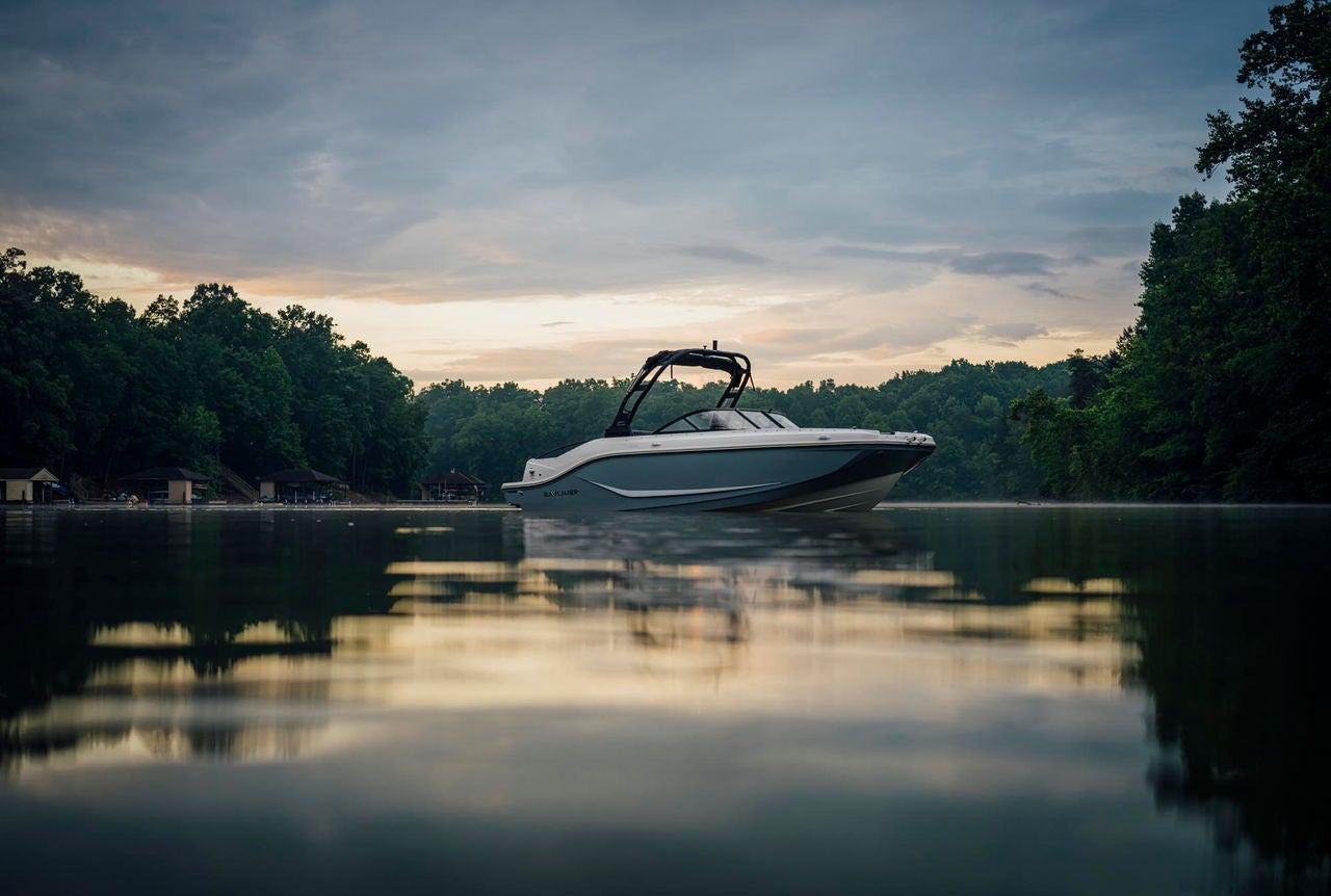 a D20i deck boat at twilight