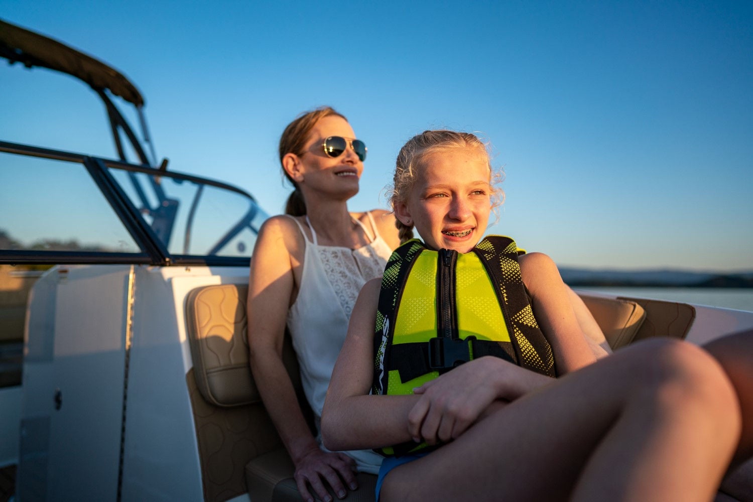 woman and daughter sitting in a VR6 bowrider boat