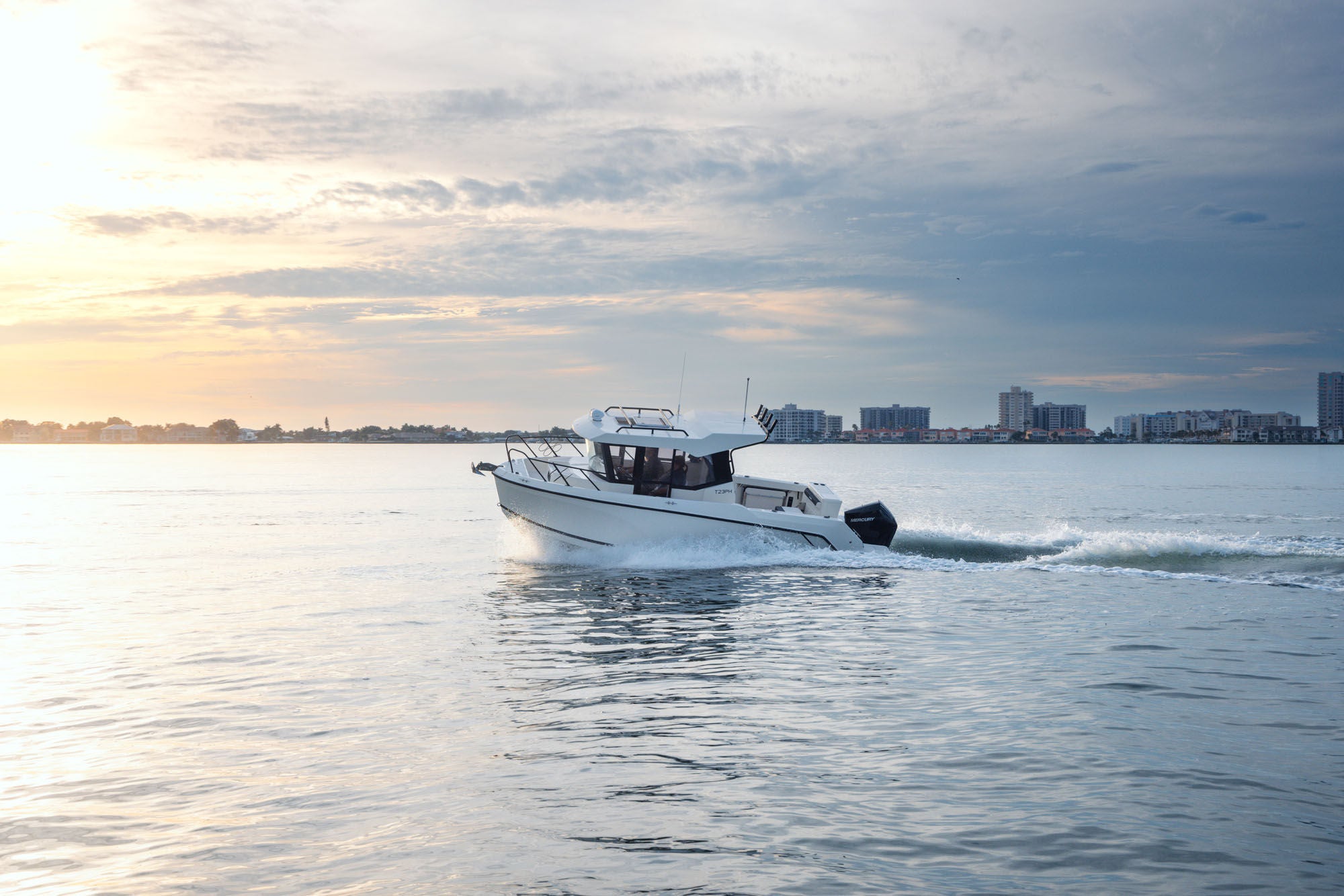 T23 Pilothouse overnight boat running at sunset