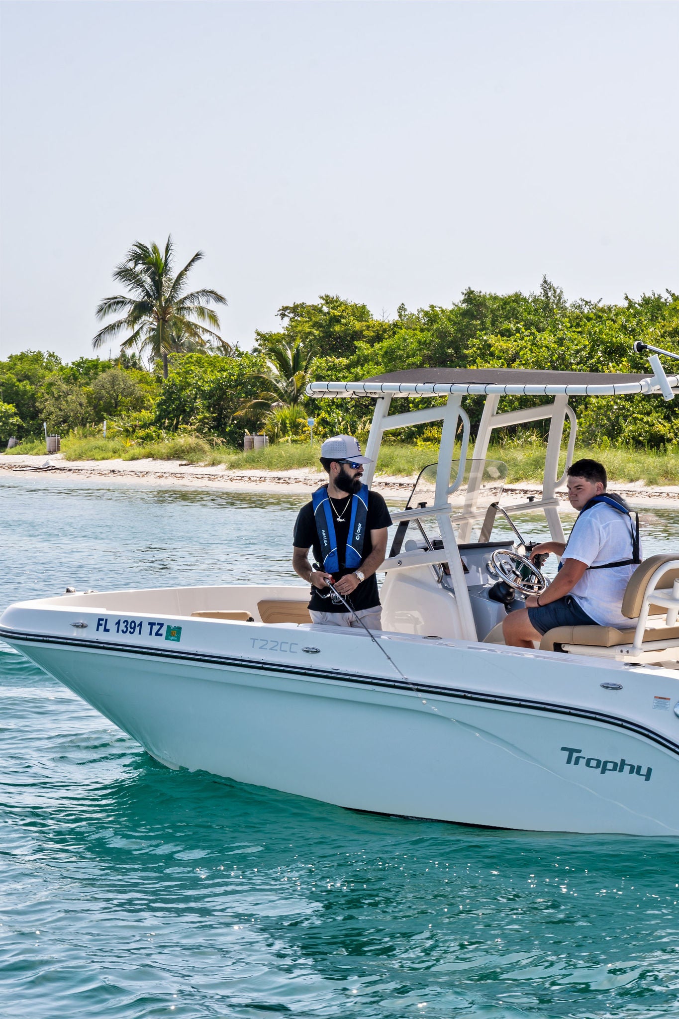 Two friends fishing just off the shore