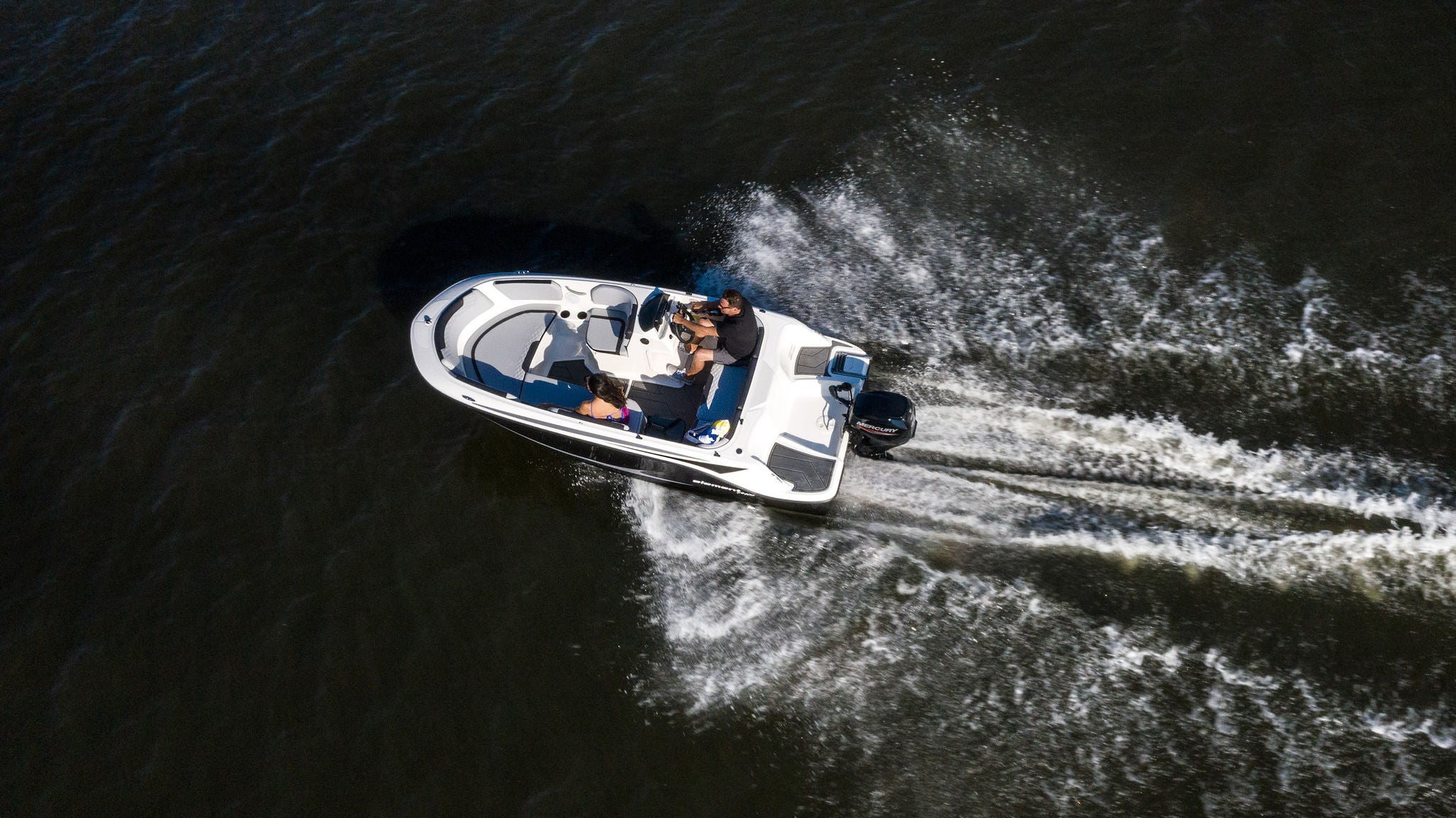 Aerial view of the Element M15 deck boat running