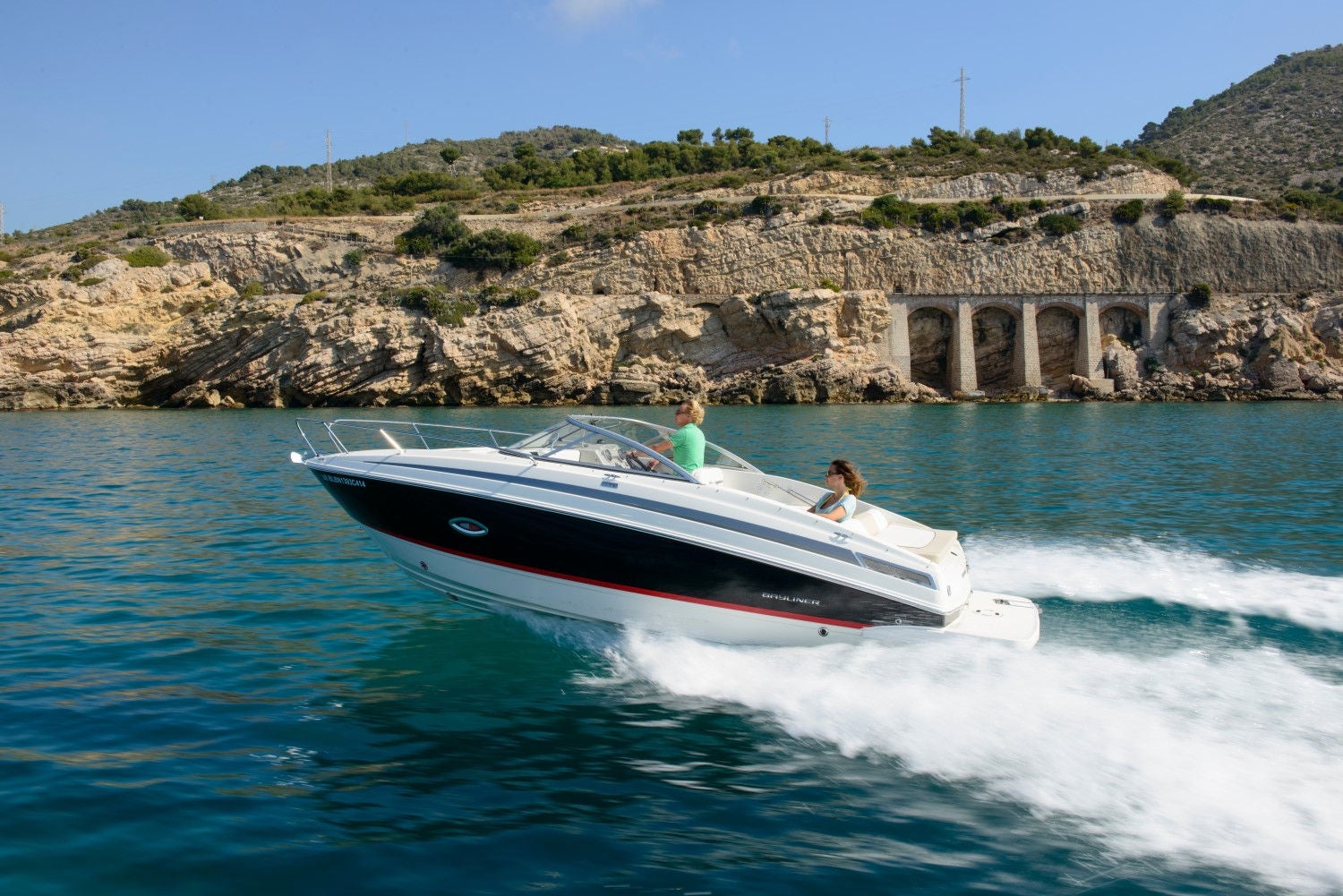man and woman riding on the 742R overnight boat