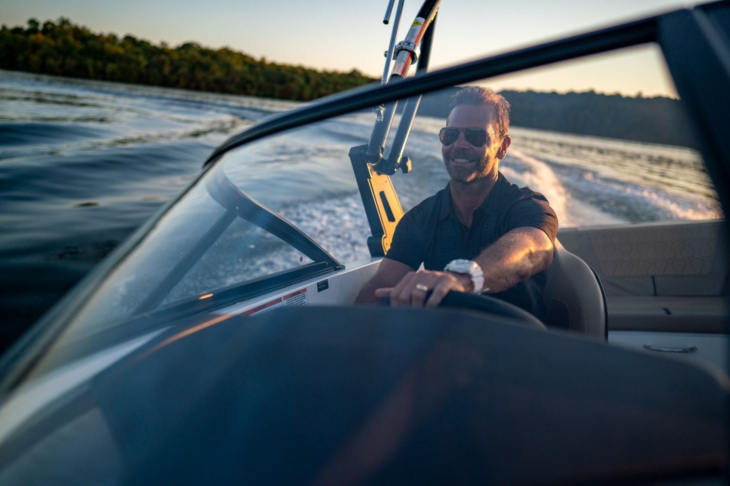 man at the helm of a VR6 bowrider boat