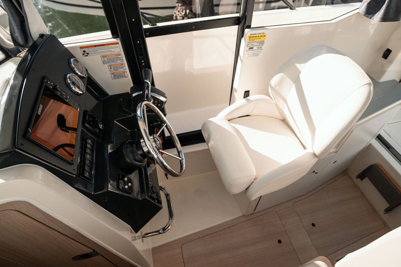 helm of the T23 Pilothouse overnight boat