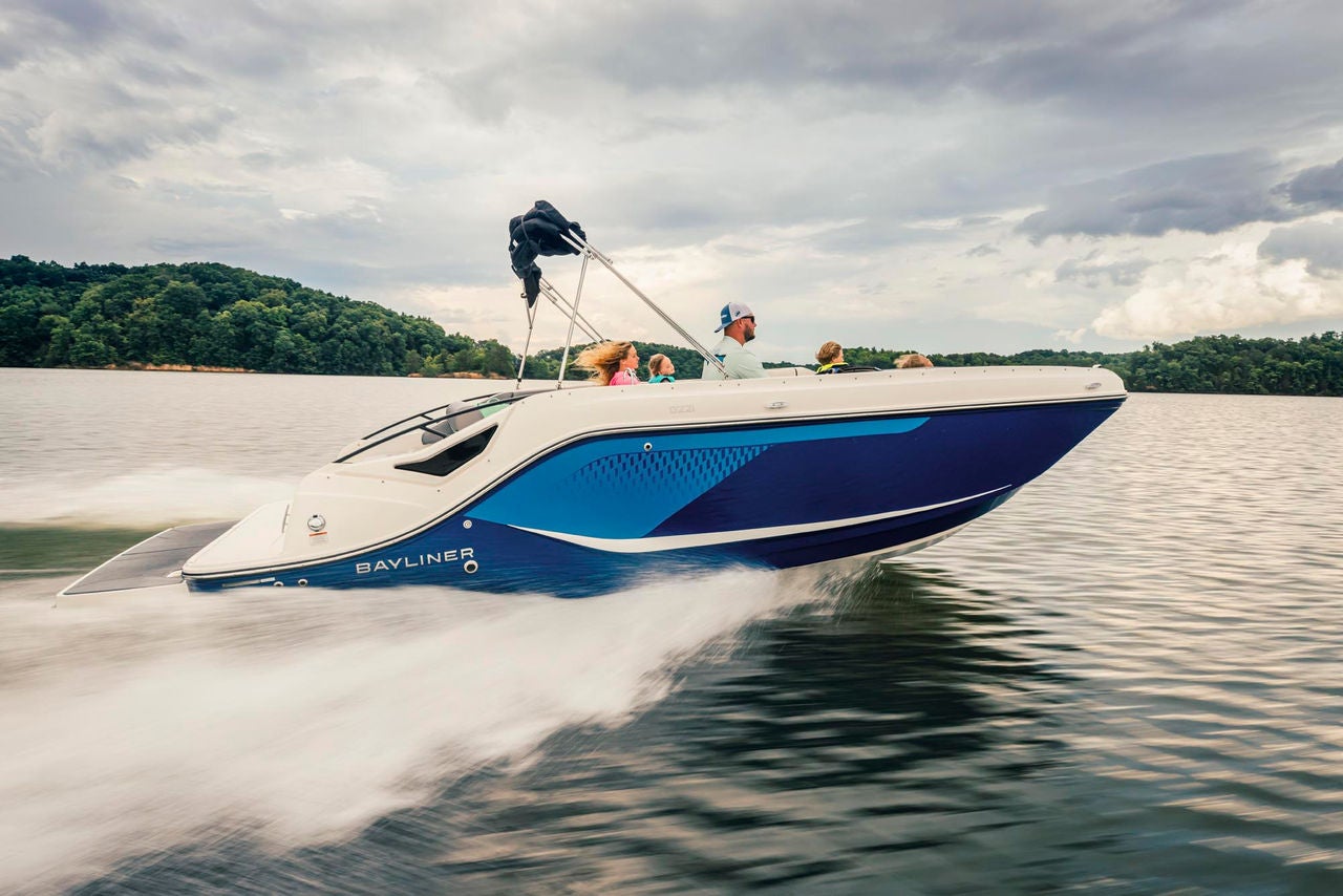 family on a running D22i deck boat