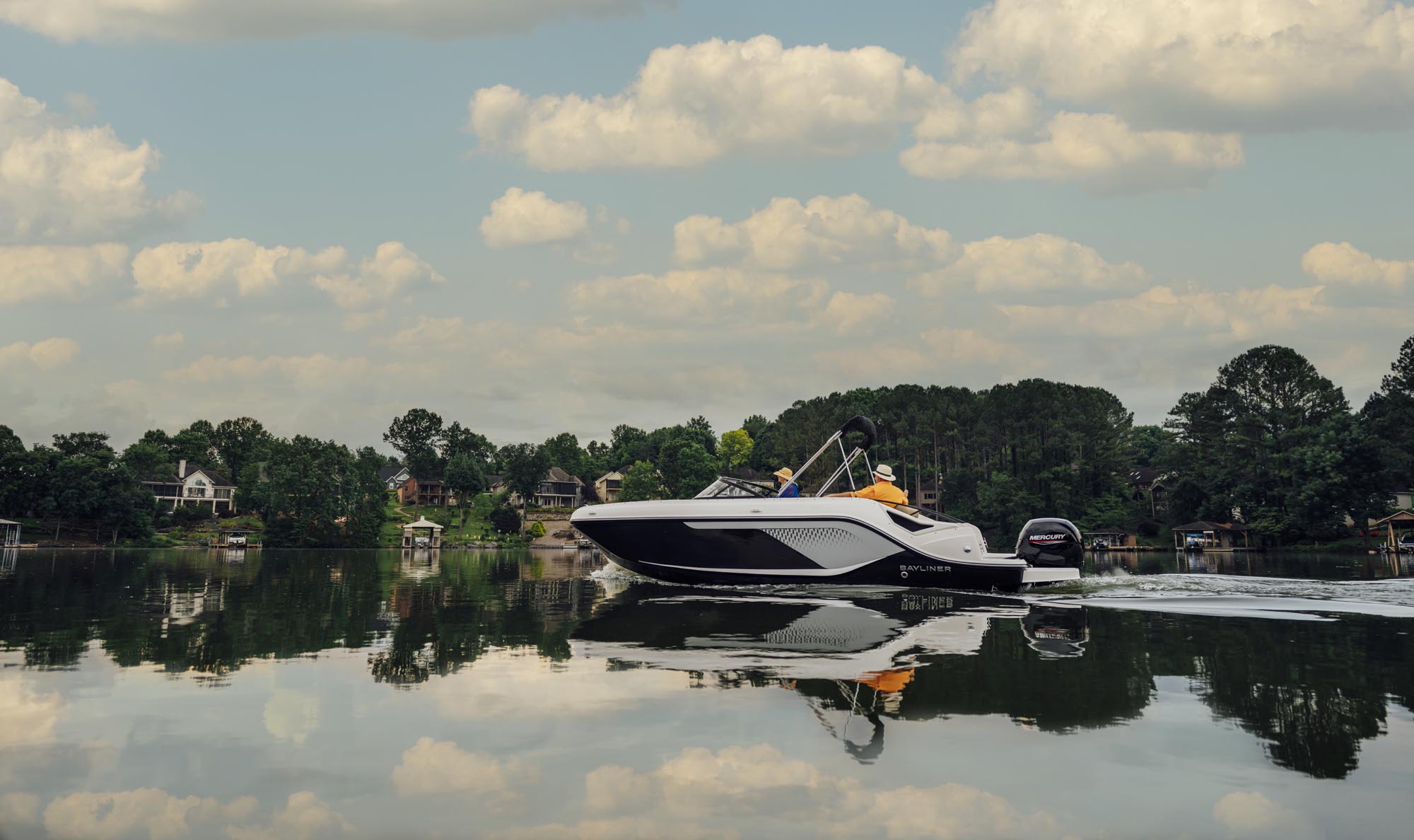 D22 deck boat cruising on a lake