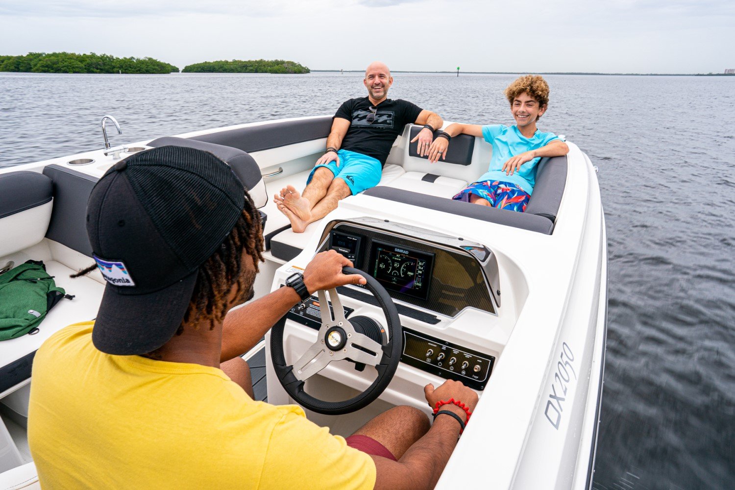 friends riding on a DX2050 deck boat