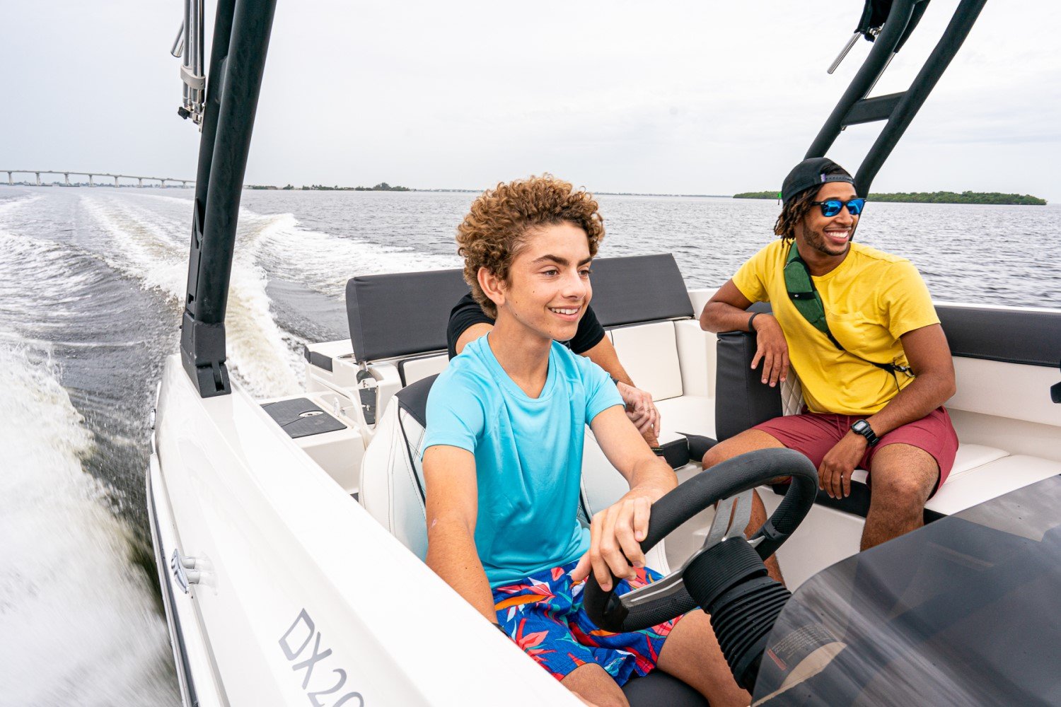 friends riding on a DX2050 deck boat