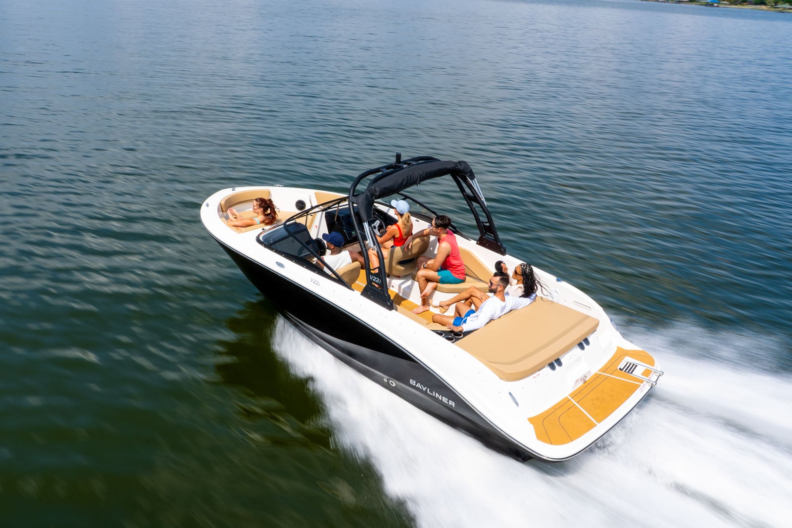 rear view of black V22 bowrider running on the water