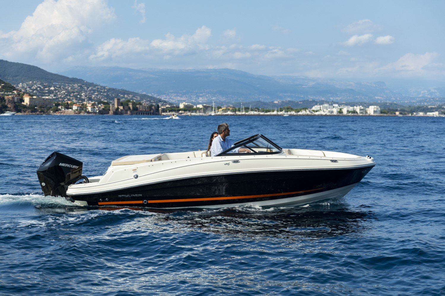 couple riding on a VR5 outboard bowrider boat