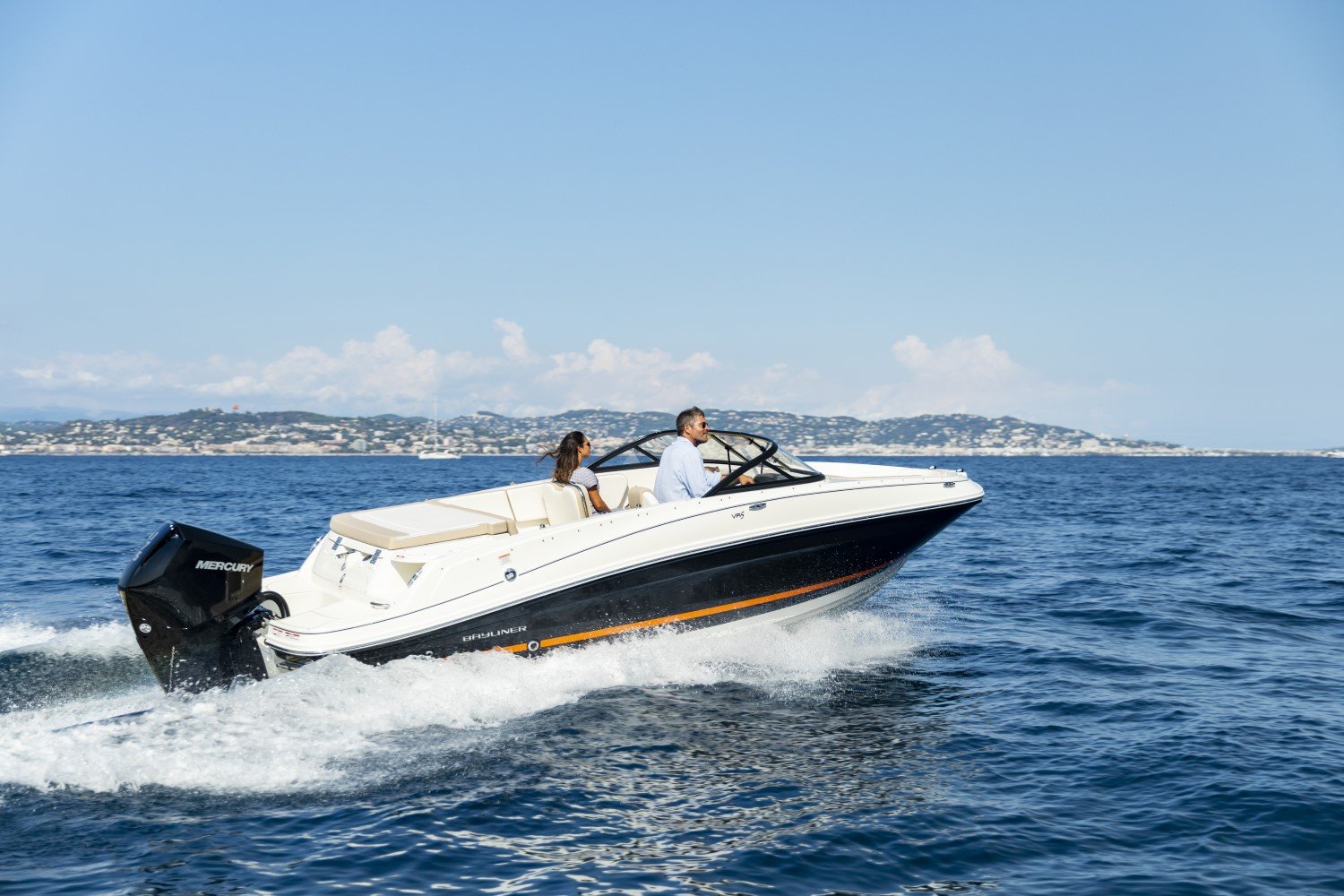 couple riding on a VR5 outboard bowrider boat
