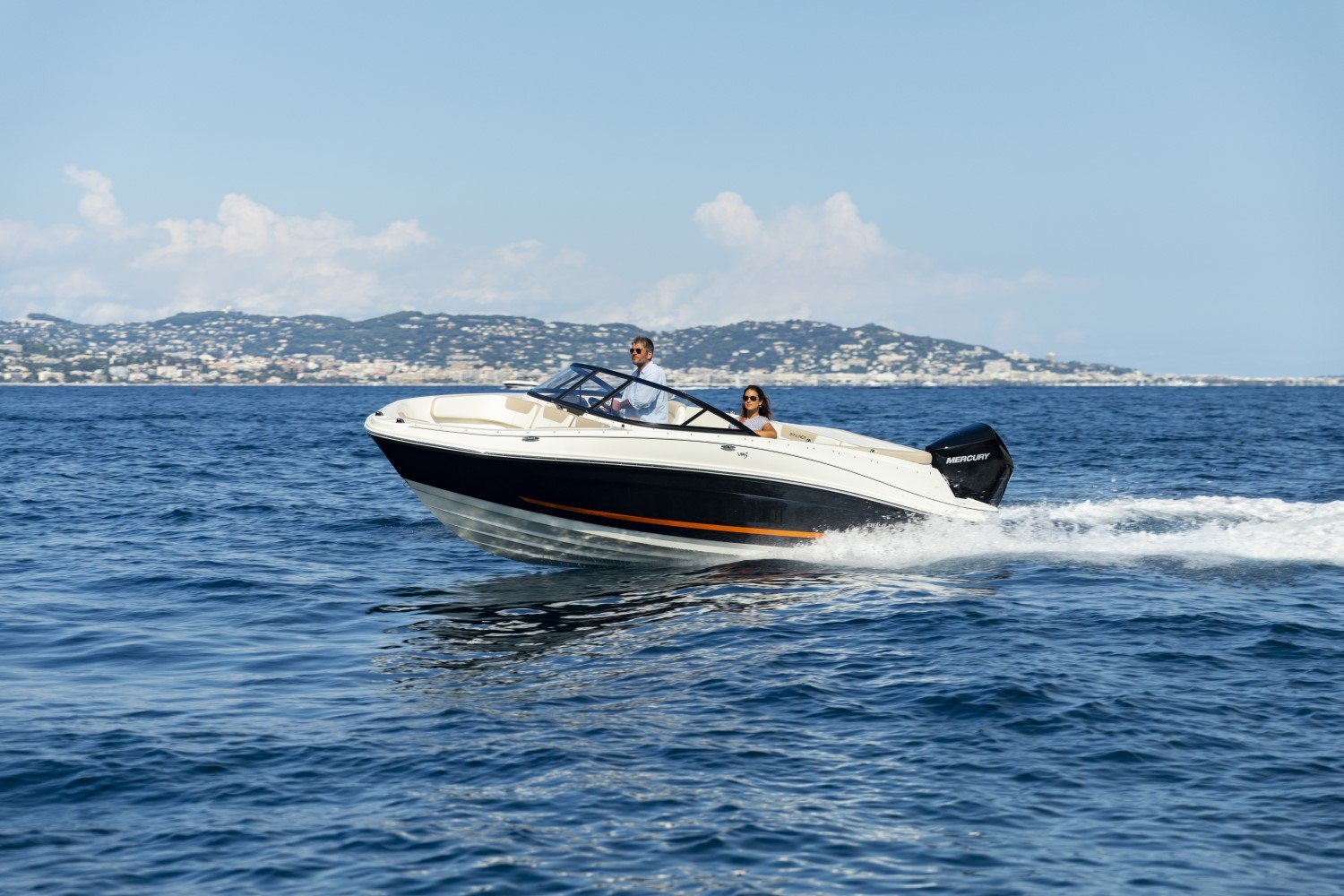 couple riding on a VR5 outboard bowrider boat