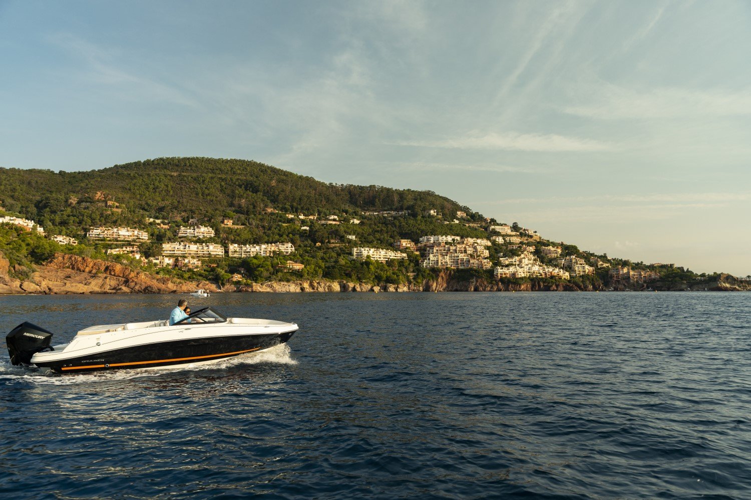 couple riding on a VR5 outboard bowrider boat