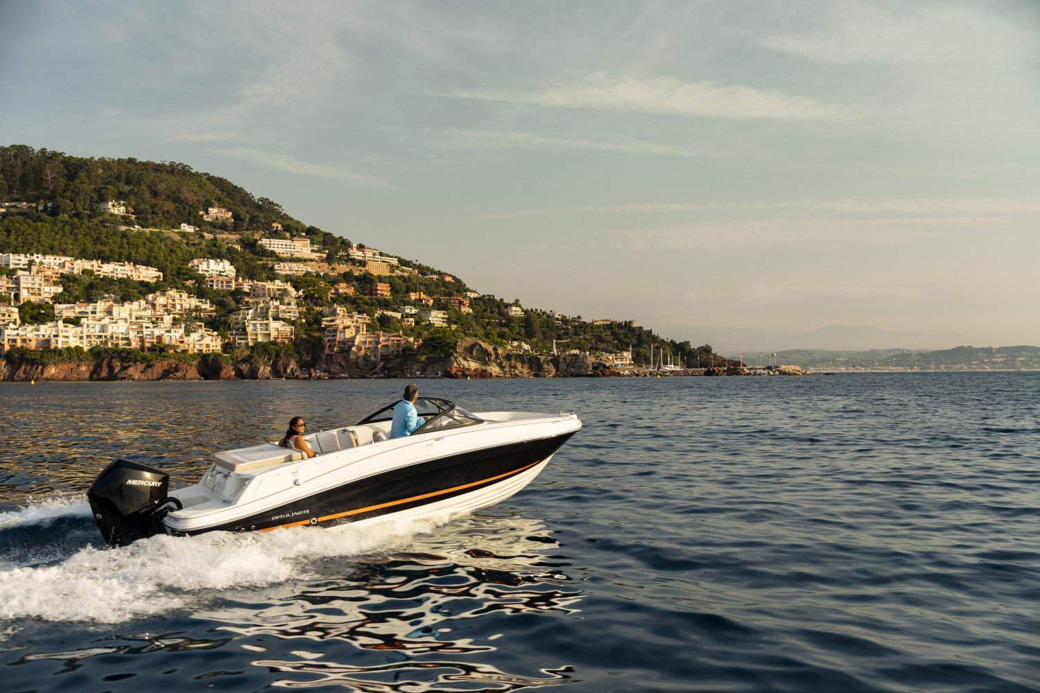 couple riding on a VR5 outboard bowrider boat