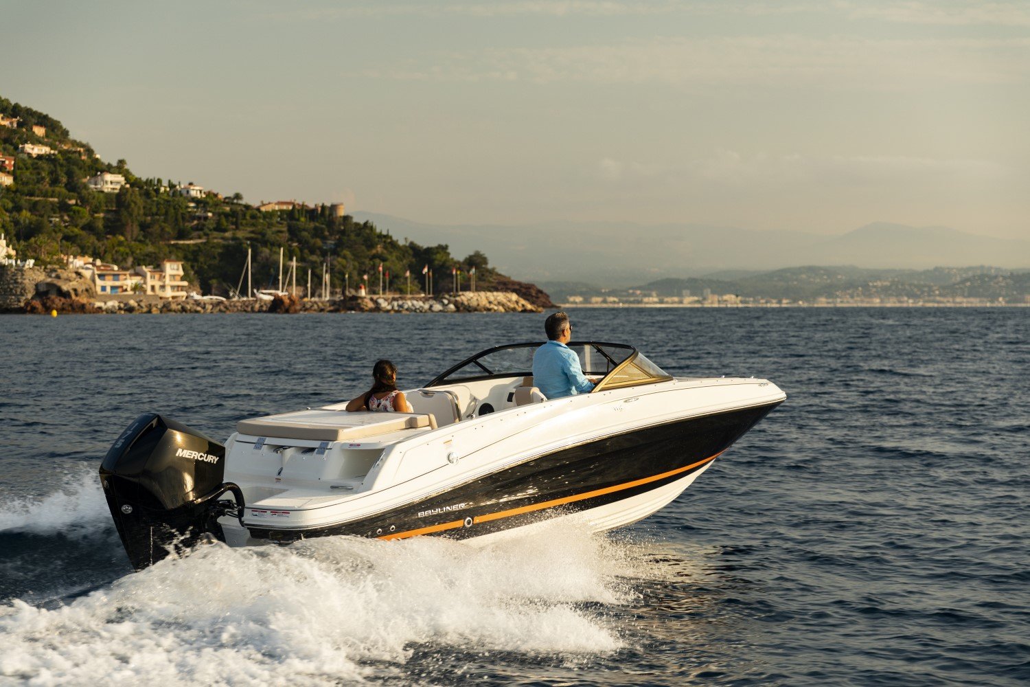 couple riding on a VR5 outboard bowrider boat