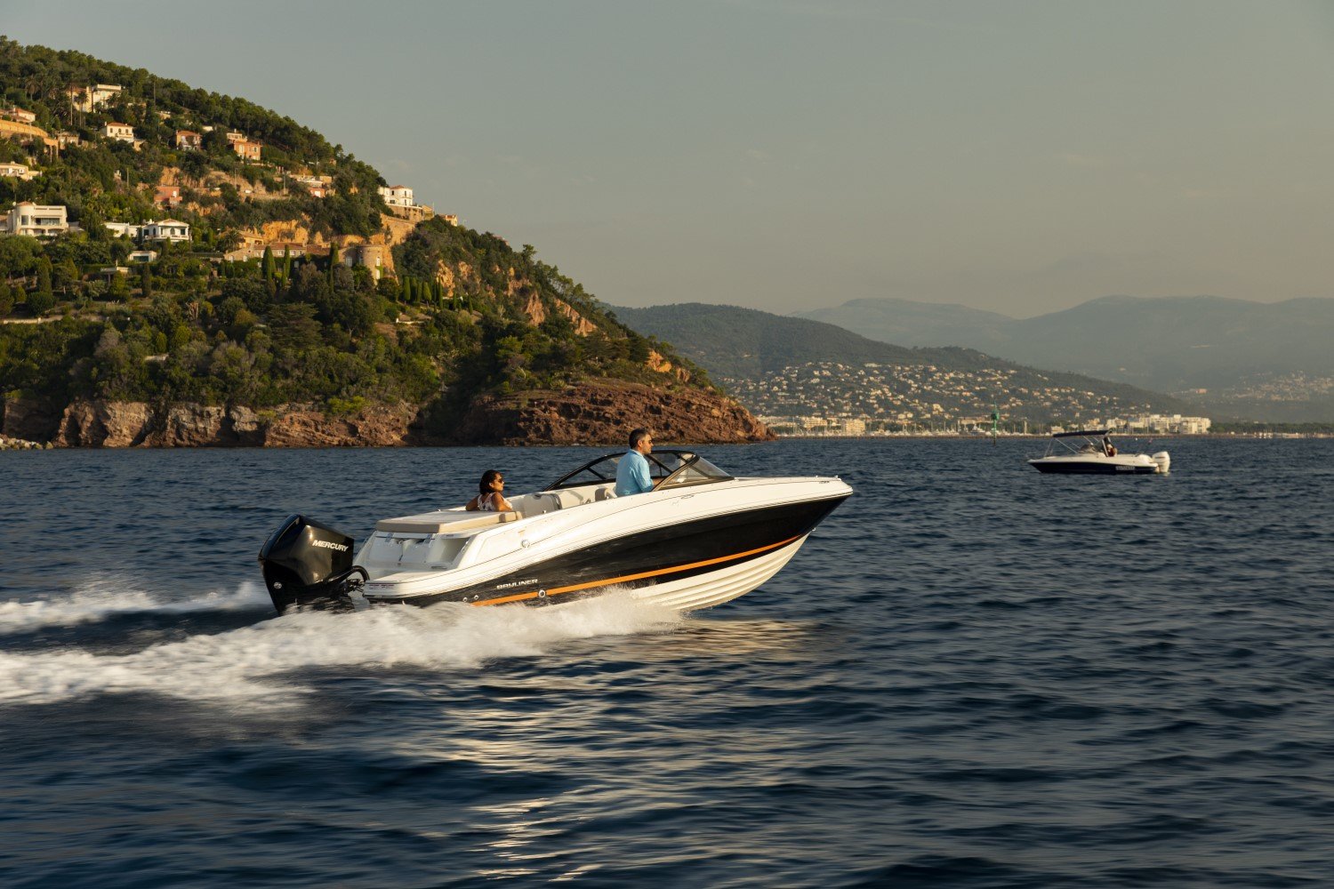 couple riding on a VR5 outboard bowrider boat