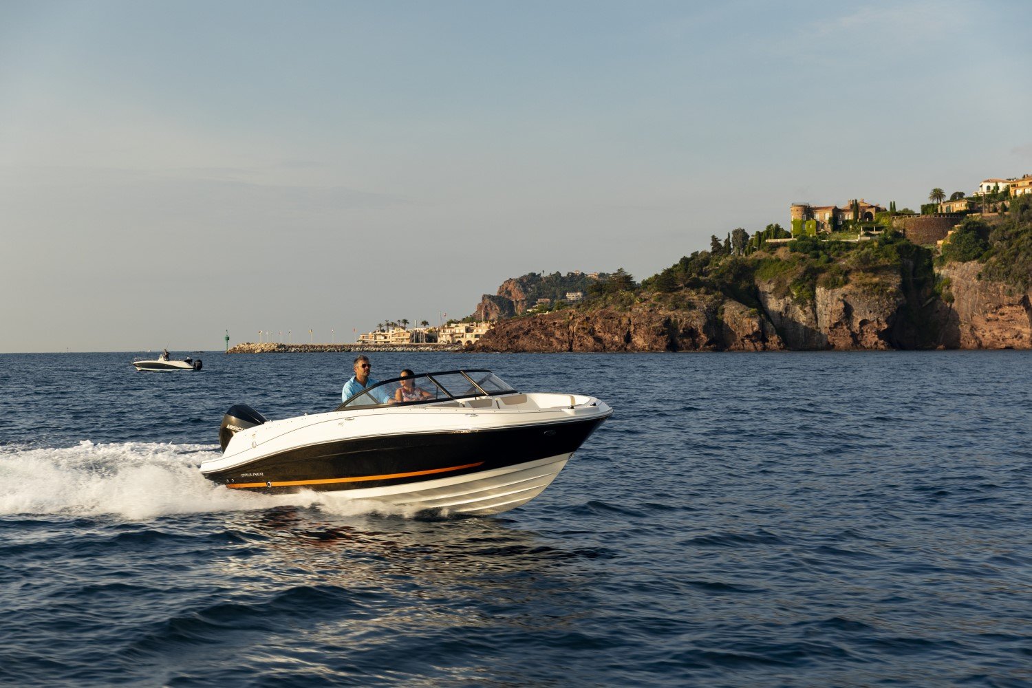 couple riding on a VR5 outboard bowrider boat