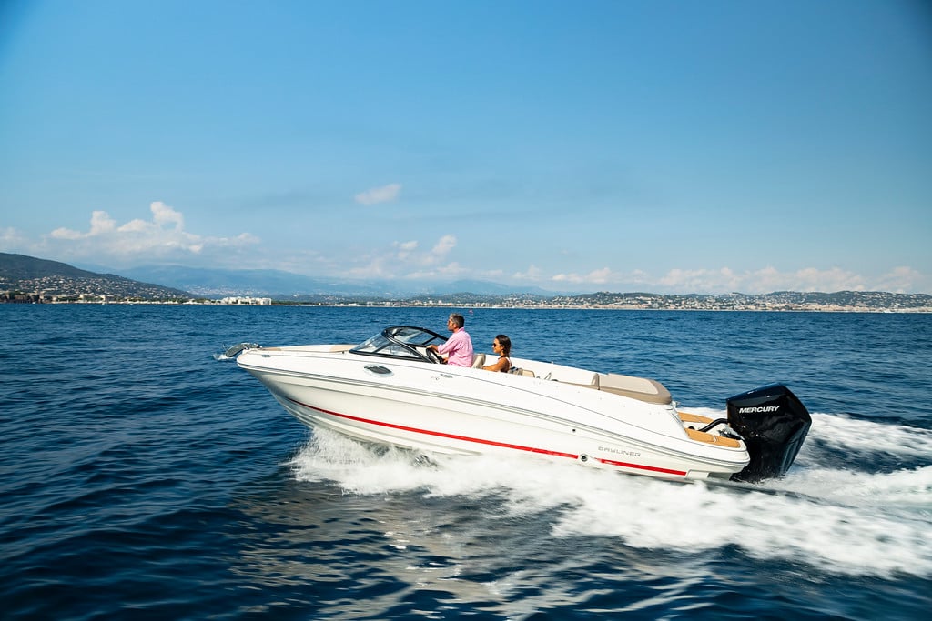 couple riding on a white VR6 bowrider boat